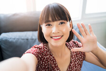 Asian Businesswoman Holding Camera Mobile Phone Taking Picture Selfie Video Call Team Meeting Conference Chat Greeting Waving Looking At Camera Smiling Joyfully, Worker Teamwork Planning Strategy