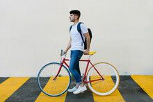 Side View Of A Caucasian Man Riding A Fixie
