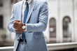 © Widetape/ADDICTIVE STOCK - Faceless shot of black businessman in suit and watch outside