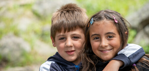 Sticker - Young children outdoor. Happy brother and sister in the park