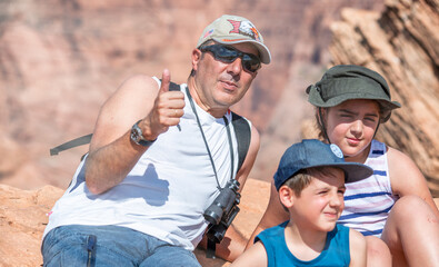 Wall Mural - Family wearing hats visiting national park in summer season