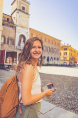 Wall Mural - happy Tourist visit city center of Modena in the main square of the city. Major destination in Emilia-Romagna, Italy