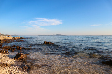 Sticker - Vrgada island far in the distance on the horizon of beautiful, blue adriatic sea off the coast of Pakostane town, Croatia