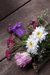 Wall Mural - flowers bouquet on wooden background