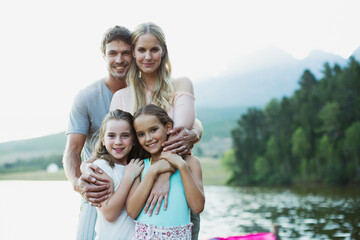 Wall Mural - Smiling family at lakeside