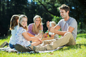 Wall Mural - Family enjoying picnic