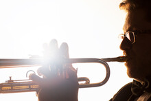 Silhouette Of Trumpeter Performing