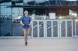 © D'Action Images - Senior man riding electric scooter in a cityscape