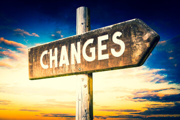 Wall Mural - Changes - wooden signpost, roadsign with one arrow