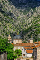 Poster - View onto Saint Nicholas or Nikole church over the red terracotta tile rooftops of the Old Town of Kotor, Montenegro