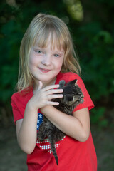 Wall Mural - Little girl and kitten