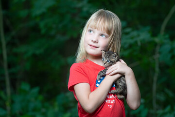 Wall Mural - Little girl and kitten