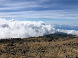 Wall Mural - High clouds rolling in  on Haleakala National Park in Maui