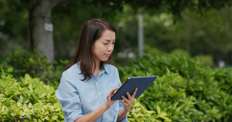 Sticker - Woman work on tablet computer at park