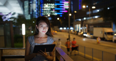 Poster - Woman use of tablet computer at street