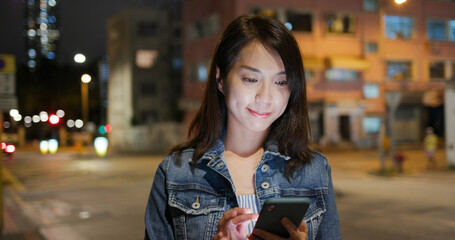 Sticker - Asian woman use of mobile phone at outdoor