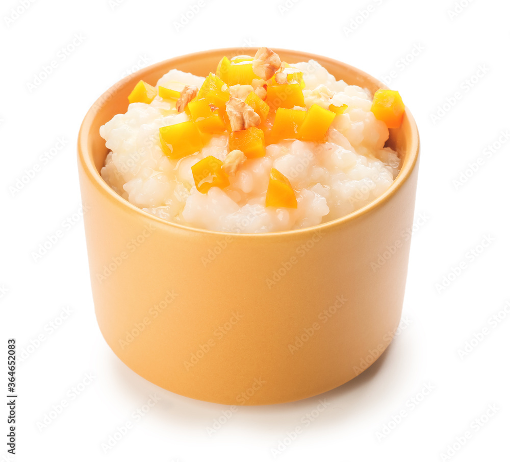 Bowl with boiled rice and pumpkin on white background