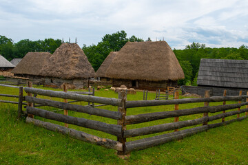 Wall Mural - traditional brick and clay house with straw and wood roof