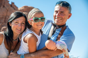 Wall Mural - Family of three people happy visiting US National Park in summertime