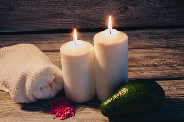 Sticker - Closeup of burning candles with avocado and salts. Composition of accessories for spa treatment. Zen and relax concept.