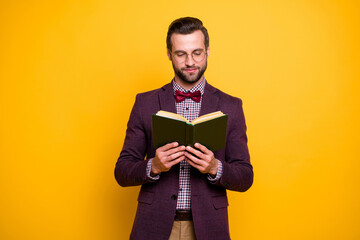 Poster - Portrait of his he nice attractive focused intelligent guy reading interesting book academic learning hobby isolated over bright vivid shine vibrant yellow color background