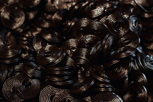 Black Jelly Flavored Licorice. Black Candy Spiral Background. Candy Shop. Street Market.