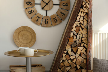 Poster - Firewood as decorative element in stylish room interior