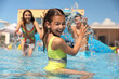 © New Africa - Happy family having fun at water park. Summer vacation