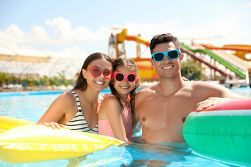 Poster - Happy family in swimming pool. Summer vacation