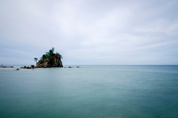 Wall Mural - long exposure shot, peaceful scenery of tropical seashore under bright sunny day. nature compositon, noise and grain effect