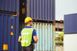 © JU.STOCKER - Factory worker man checking containers box from cargo