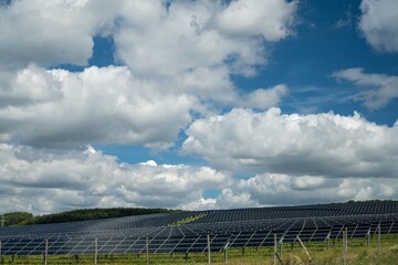 Poster - Solar panels in the field in the countryside under the cloudy sky