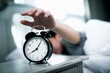 © Chaipong - man turn of  alarm clock