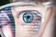 © Роман Мельничук - Close up of blue hacker eye with Glasses. Reflection of computer code in glasses. Focused on work Software developer looking at the computer. Hacking, vision and technology concept
