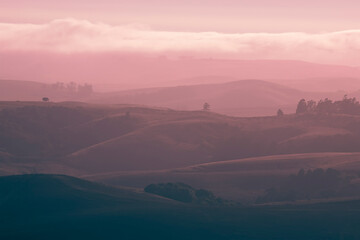 View of Mountains and rolling Hill in Mist