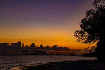 Wall Mural - Dark sunset over the  ocean shore. Africa.