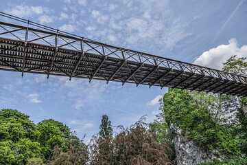 63-meter-long suspension bridge (1867) in Buttes-Chaumont Park (Parc des Buttes-Chaumont, 1867) - Public Park situated in northeastern Paris, fifth-largest park in Paris. Paris. France.