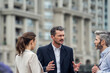 © PhotoAlto - Businesspeople talking in city