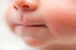 © Юлия Ефимова - Newborn baby lips. Close up. Face of baby boy. Blurred.