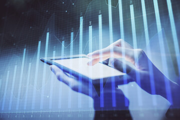 Double exposure of forex chart sketch hologram and woman holding and using a mobile device. Financial market concept.