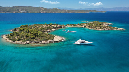 Aerial drone photo of Chinitsa bay a popular anchorage crystal clear turquoise sea bay for yachts and sail boats next to Porto Heli, Saronic gulf, Greece