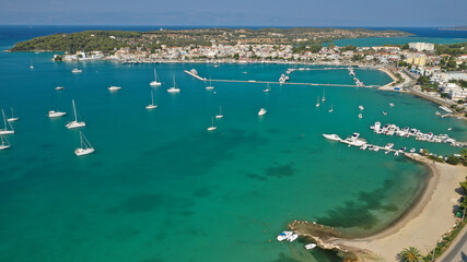 Aerial drone photo of beautiful fjord landscape forming turquoise beaches in small vegetated coves in Porto Heli a popular anchorage for yachts and sail boats, Argolida, Greece