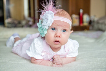 Portrait of cute adorable white Caucasian baby girl boy with one months old