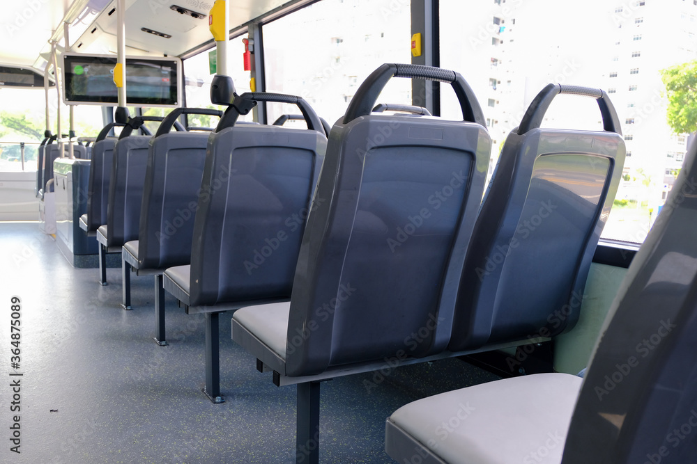 Back view of bus seats on double decker bus. Blank advertising space ...