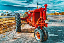 An Old Tractor Stands In The Fields Of Arizona.