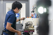 © Auttapol - Creative mechanical engineer working on machines