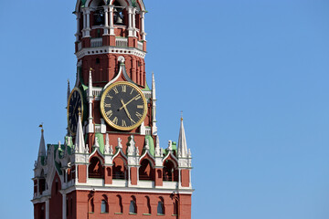 Wall Mural - Chimes of Spasskaya tower, symbol of Russia on Red Square. Moscow Kremlin tower isolated on blue sky background