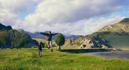 Wall Mural - father and son running in the mountains