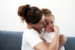 © etonastenka - The mother pities daughter.The little girl is sad. Mother becalms litlle girl