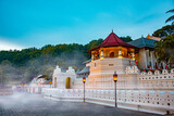 Temple of the tooth, a Buddhist temple also known as Sri Dalada Maligawa, covered with fog in Kandy, Sri Lanka. morning view, well famous destination among tourists. 